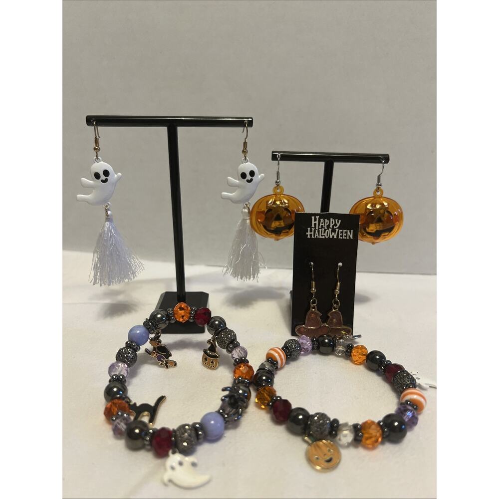 2 HALLOWEEN Charm bracelets . PLUS 3 New pair of earrings And 1 Used Pair